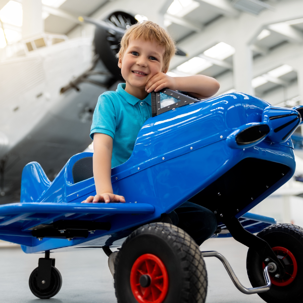 Cute Little Boy In Toy Airplane 600X600
